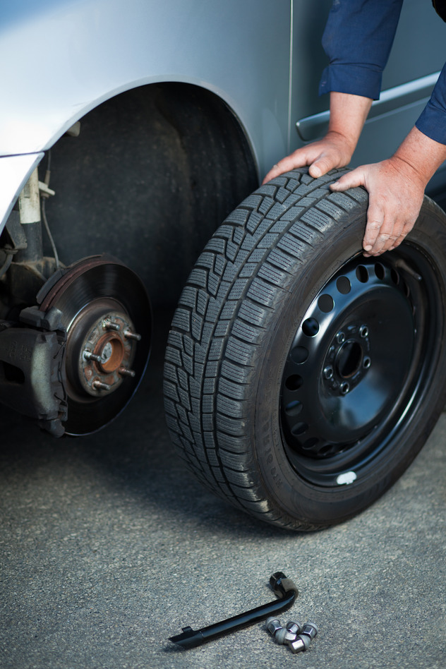 mechanic-changing-a-wheel-of-a-modern-carfga.jpg